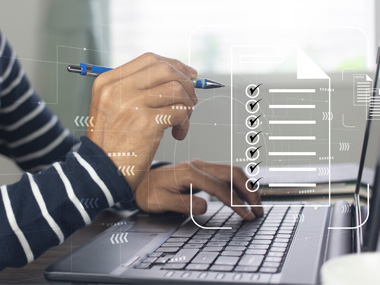 An artistic graphic image of a man holding a pen and checking off a virtual checklist.