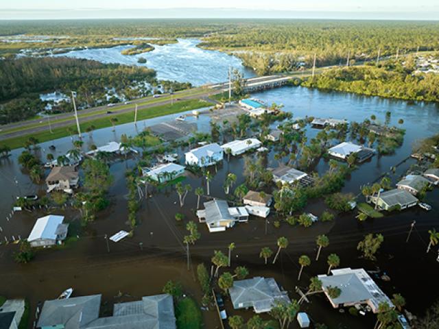 Aerial view of homes flooded by a natural disaster