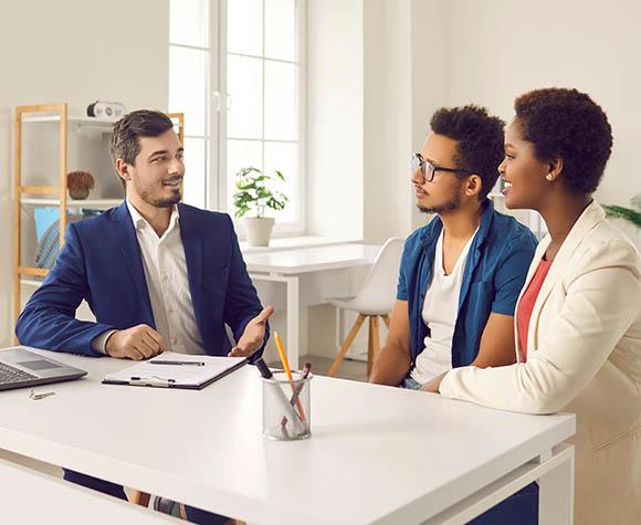 couple and lender sitting at table